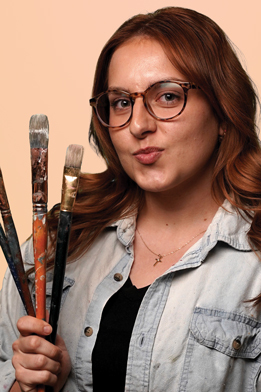 portrait photo of SYDNEY HEBERT Graphic Designer of burning stick creative alternate